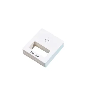White smiley face earring display cards packaging cardstock for jewelry display and retail use.