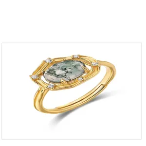 Close-up detail of the vintage gold-plated green moss agate ring with cubic zirconia.