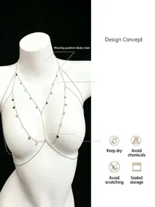 Silver layered body chain with delicate disc pendants, elegant shoulder and chest jewelry.
