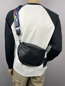 Men's black sling bag with colorful ethnic pattern strap, casual fashion crossbody chest bag.