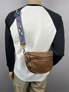 Stylish retro brown men's crossbody bag with colorful woven strap for casual daily wear.