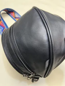 Black spherical shoulder bag with colorful strap, retro design casual crossbody bag for daily wear.