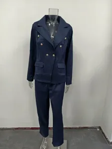 Dark blue women suit set detail, elegant slim fit double breasted blazer and matching pants.