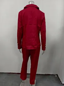 Details of women red slim fit suit jacket and pants set, showing tailored back view and buttons.