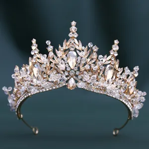 Exquisite gold crystal tiara detail close up, sparkling rhinestones for bridal wedding hair.