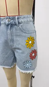 Light blue high-waist denim shorts with colorful floral print, casual wide-leg knee-length