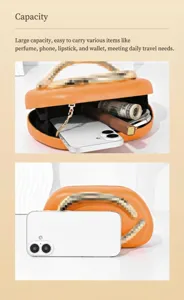 Orange vintage metal handle box bag detail showing inner capacity for phone and daily items.