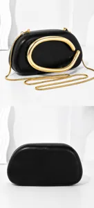 Black evening bag with metal chain strap and unique metallic handle for stylish women parties.