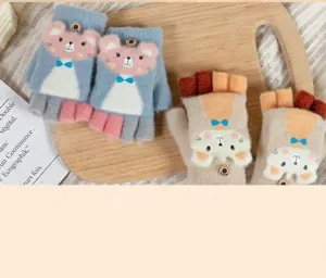 Close-up of cute cartoon bear knit gloves with flip-top half-finger design for kids.