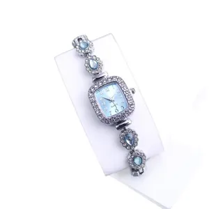 Elegant rectangular rhinestone quartz watch for women with blue crystal drop bracelet.