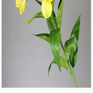 Artificial Alstroemeria flower detail close-up, yellow floral stem for home decoration.