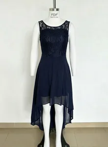 Close-up detail of the elegant navy blue lace top and high-low chiffon skirt design.