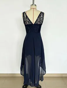 Detailed view of the dark blue sleeveless lace bodice and high-low chiffon hem evening dress.