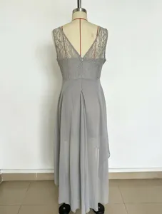Grey sleeveless evening dress detail showing hollow lace bodice and long chiffon skirt.