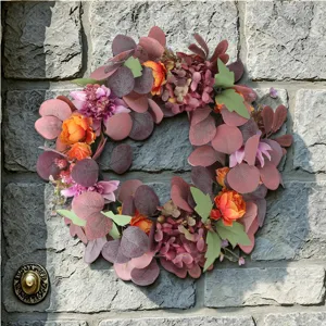 Autumn artificial flower wreath for front door decor, hanging faux eucalyptus leaves and peonies.