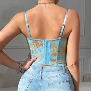 Back detail view of blue mesh corset top featuring gold floral print and adjustable straps.