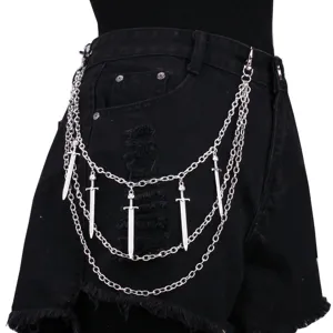 Close-up detail of multi-layer silver metal pants chain with punk sword pendants for streetwear.