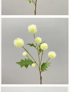 Primer plano detallado de tallo de flor artificial amarilla de bola para decoración.