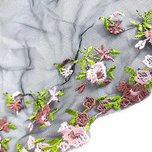 Black mesh lace trim detail featuring colorful floral embroidery for DIY clothing crafts.