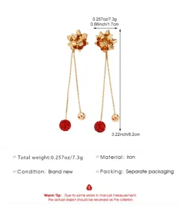 Detailed specification view of gold bowknot drop earrings with red crystal ball for party.