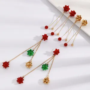 Exquisite Christmas bow tassel earrings detail view, showing the red green gold design.