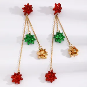Christmas metallic bow long chain dangle earrings in red, green and gold for holiday party.