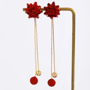 Red bow rhinestone ball long dangle earrings for holiday party festive jewelry style detail view
