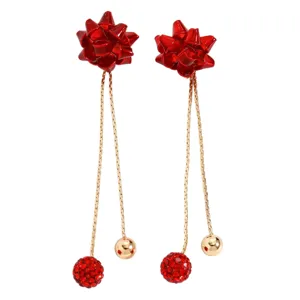 Red bow long tassel earrings with rhinestone balls and gold spheres for Christmas holiday party gifts.