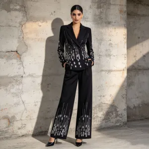 Black blazer and pants set featuring silver sequin embellishments, elegant long sleeve design.