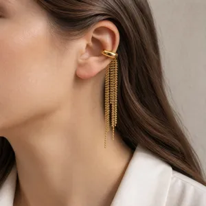 Gold stainless steel non piercing ear cuff featuring delicate tassel chains detail closeup view.
