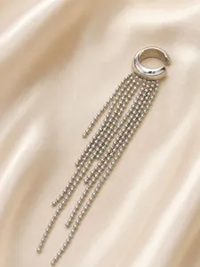 Detail shot of the stainless steel ear cuff with delicate bead chains tassel design.