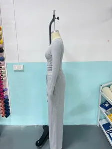 Grey solid color round neck long sleeve top and long pants lounge set detail view.