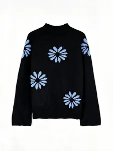 Detailed view of black knit pullover sweater featuring light blue floral patterns and ribbed details.