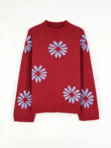 Women's red knit pullover sweater with blue flower pattern, long sleeve ribbed winter top.
