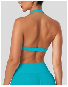 Back view detail of turquoise halter yoga sports bra, breathable fitness activewear top.