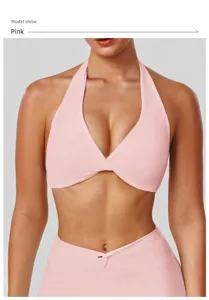 Pink halter yoga sports bra, sleeveless fitness crop top for gym workout and running.
