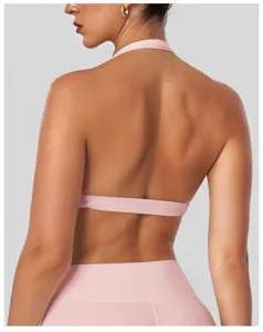 Detailed back view of pink halter yoga sports bra, breathable activewear for fitness and running.