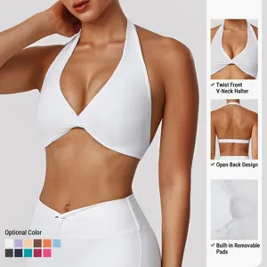 Halter yoga sports bra with twist front and open back, removable pads for fitness running.