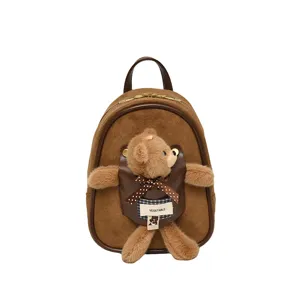 Brown suede-look mini backpack with leather trim, front pocket and plush bear bow charm