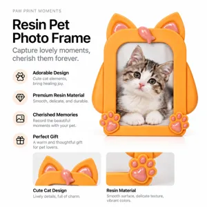 Close-up of orange resin frame with pink cat ears and paw decorations against white background