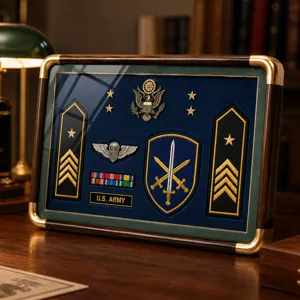 Display of gold military insignia, stars, ribbons and crossed-sword badge on a blue velvet backing