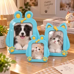 Three blue cartoon pet photo frames with yellow paw and bone accents, arranged on a tabletop
