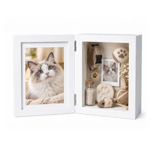 White hinged pet memorial photo frame with a cat portrait and keepsake display compartment