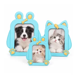 Set of three blue cartoon pet photo frames with cat and dog ears, yellow bone and paw accents