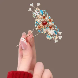 Chinese-style hairpin with a gold-tone frame, blue enamel, red gems, white pearls and floral accents