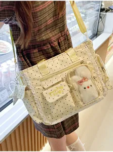 Sac porté en bandoulière, à pois beiges, bordure en dentelle, poche transparente et ourson