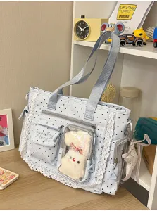 Sac bleu à pois avec dentelle, zip, poche transparente et petit lapin en peluche accroché