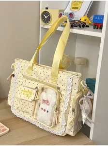 Sac jaune à pois, dentelle décorative et poche avant transparente avec un petit ours en peluche
