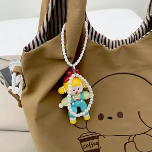 Sac cabas marron à imprimé cartoon, grand format porté à l’épaule avec breloque perlée