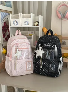 Sacs à dos rose et noir à motifs d’étoiles et de pois, fenêtre transparente et breloques étoilées